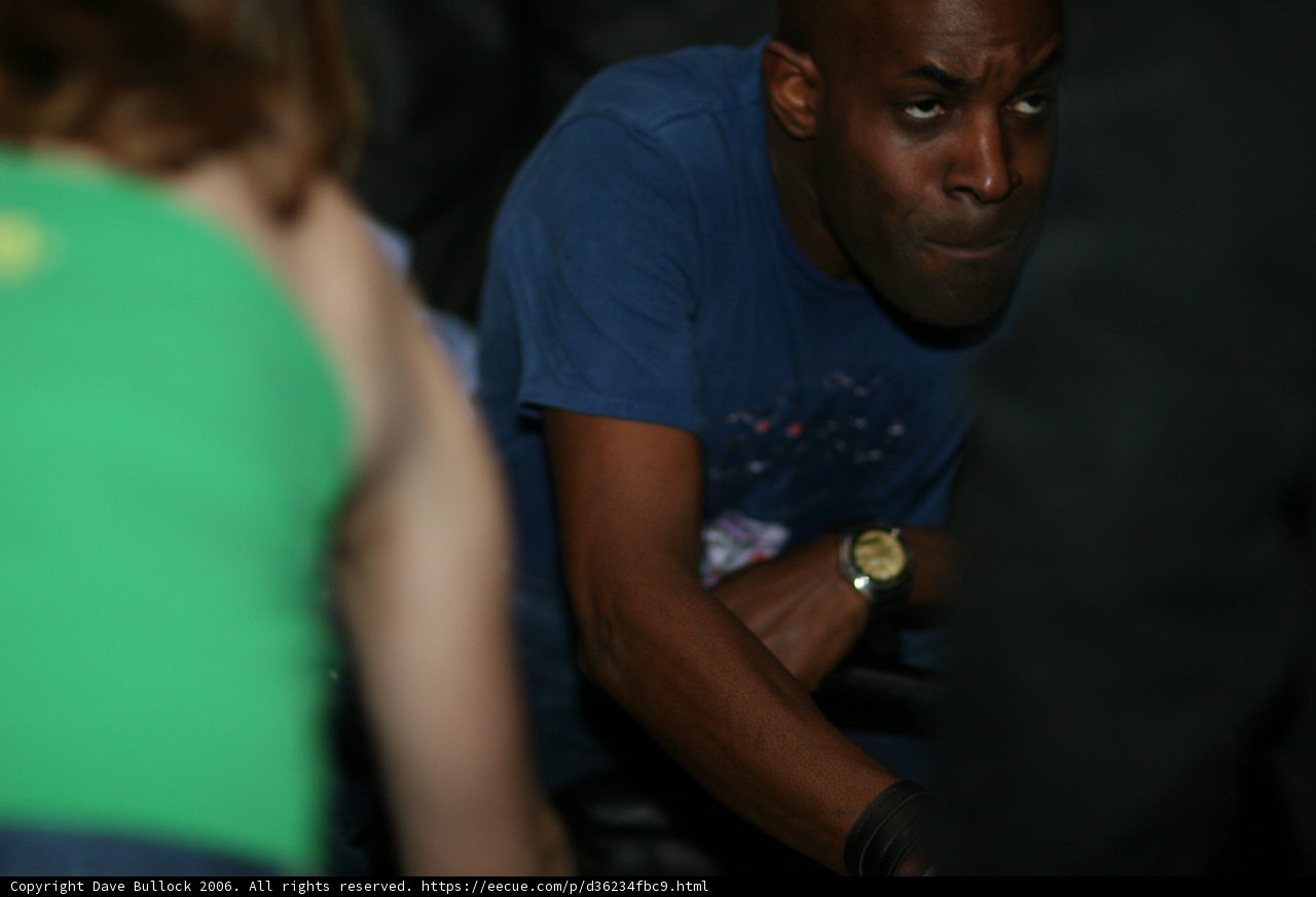 Blue Shirted Man Tells Time