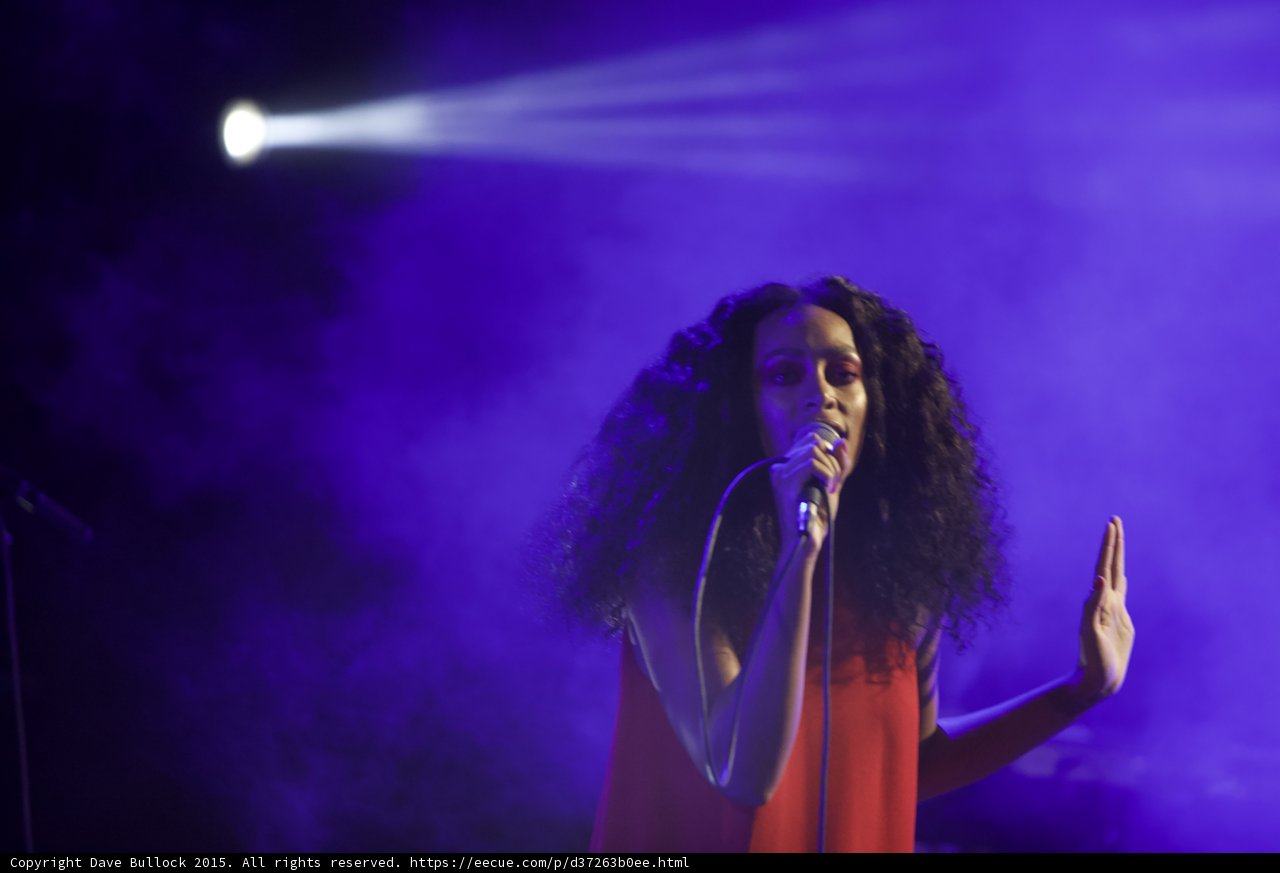 Solange Singing Hand Palm Out Spotlight Beam Purple Haze