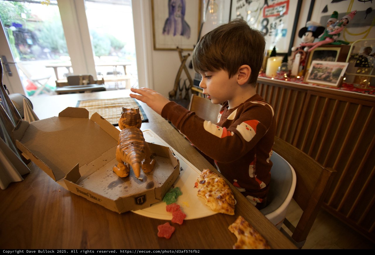 Child's Wonder at Christmas Pizza Dinosaur Meal