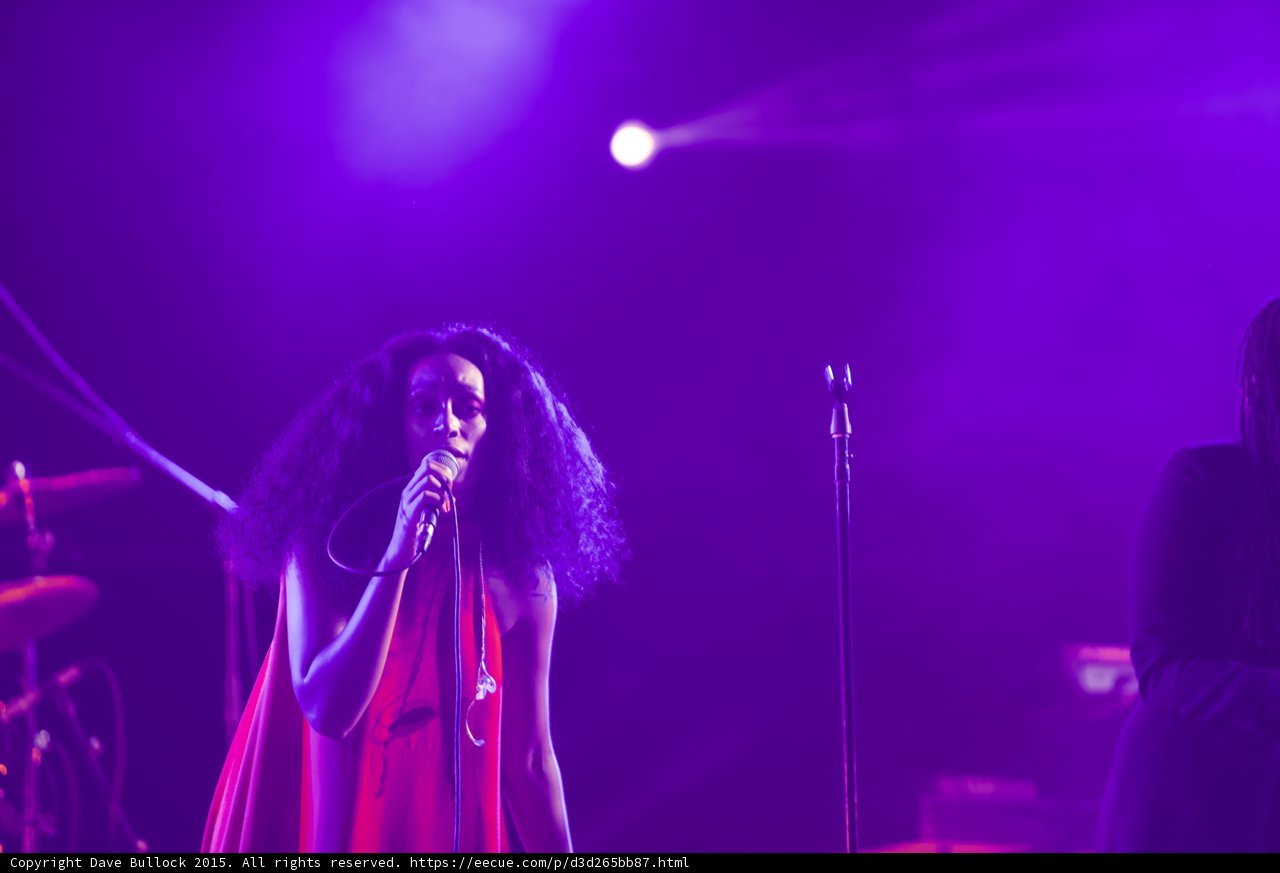 Solange Portrait Red Dress Singing Looking Down Backing Vocalist Spotlight Purple
