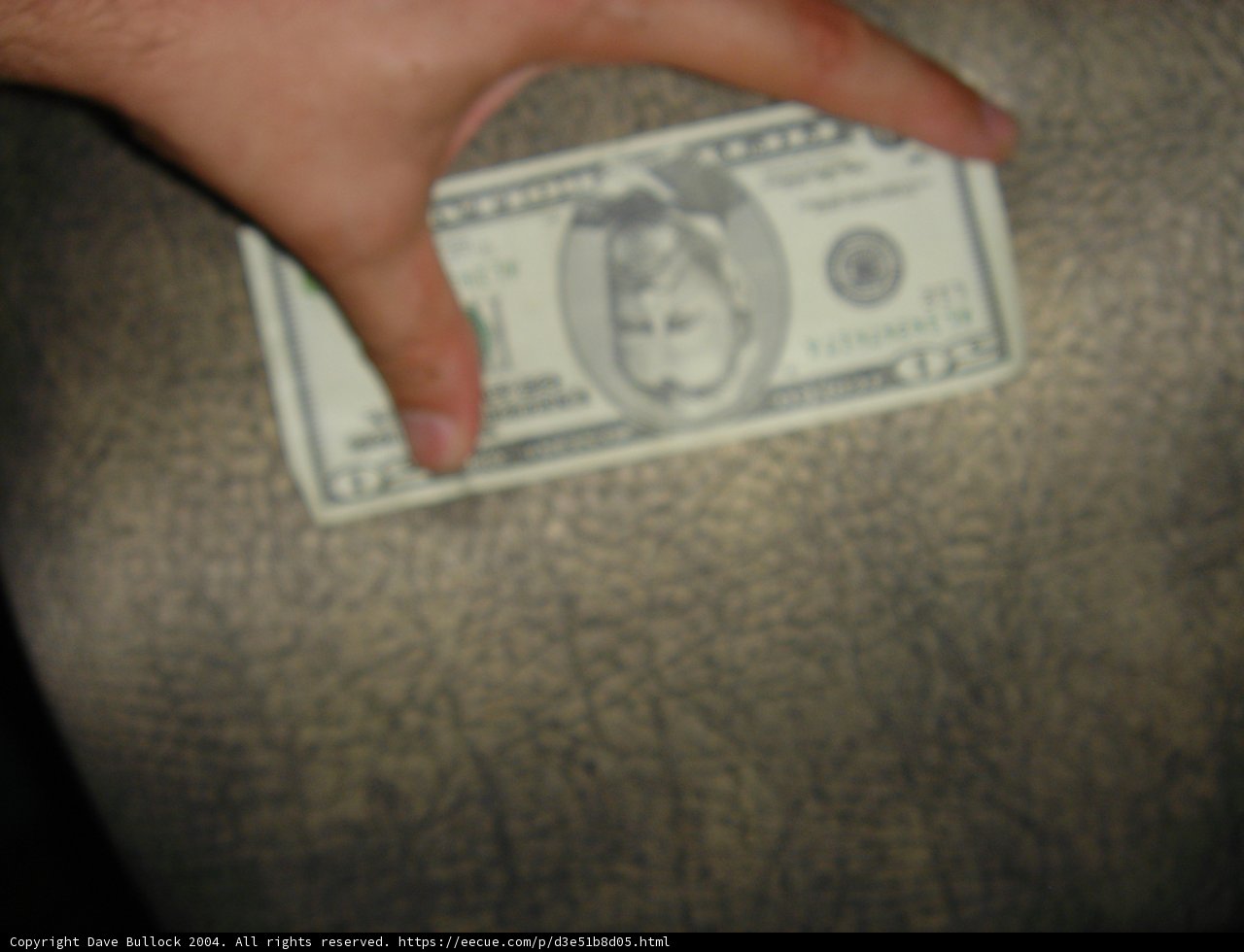 Ulysses S. Grant Holding a Dollar Bill