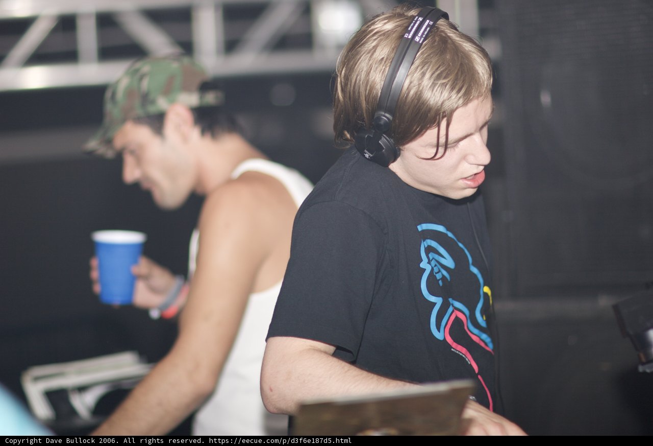 Man in Black T-Shirt Listening to Music with Headphones