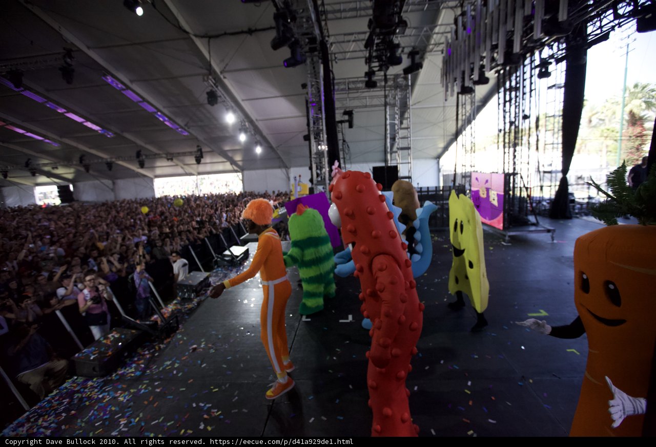Stage Performance with Costumed Crowds
