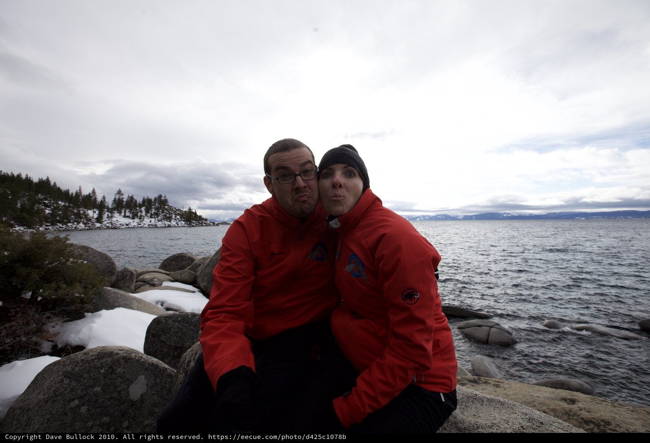 Playful Couple Posing at Snowy Lake Tahoe Shore