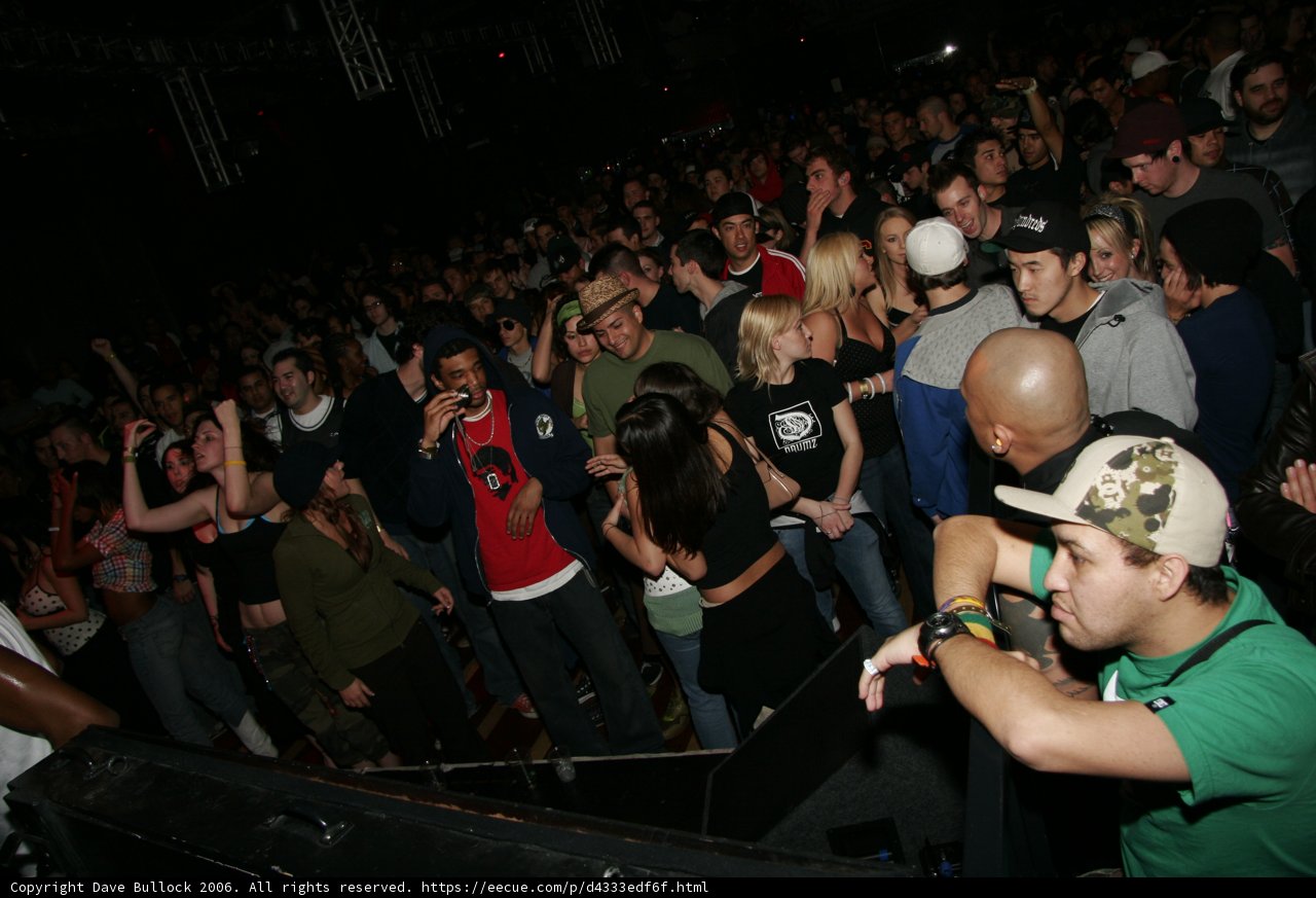 Green-Shirted Fan Gets Lost in a Sea of Urban Nightlife