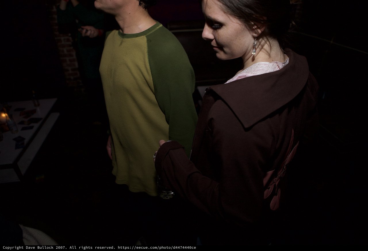 Intimate Moment Between Two People at Dark Venue