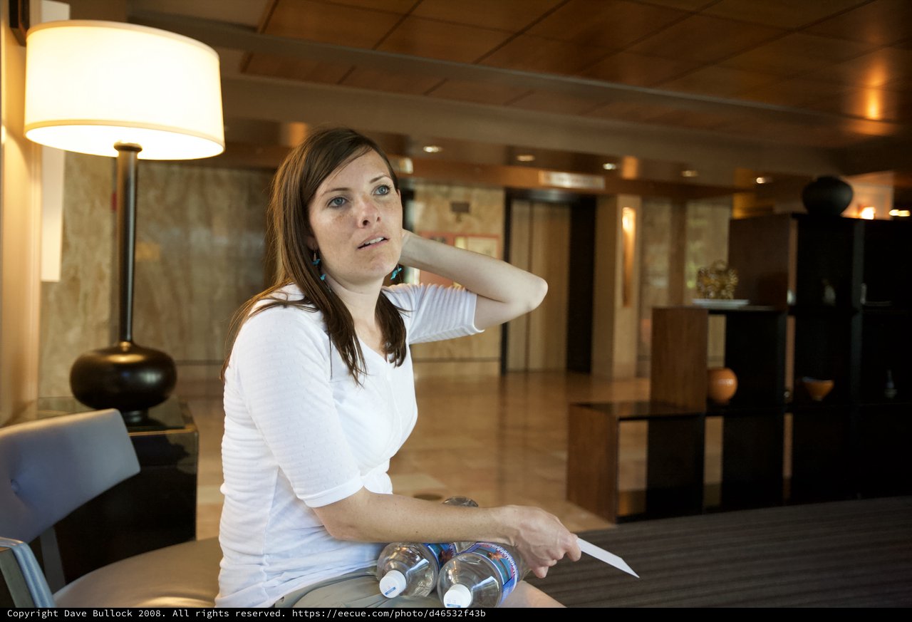 Woman Waiting in Warm Hotel Lobby Atmosphere