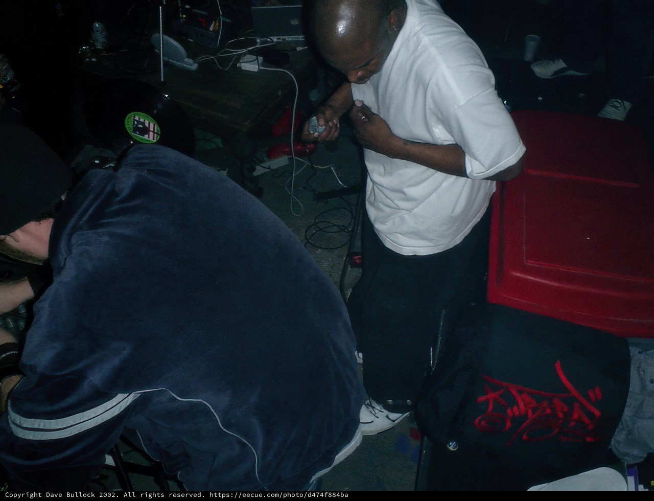 Two Men in a Dark Room