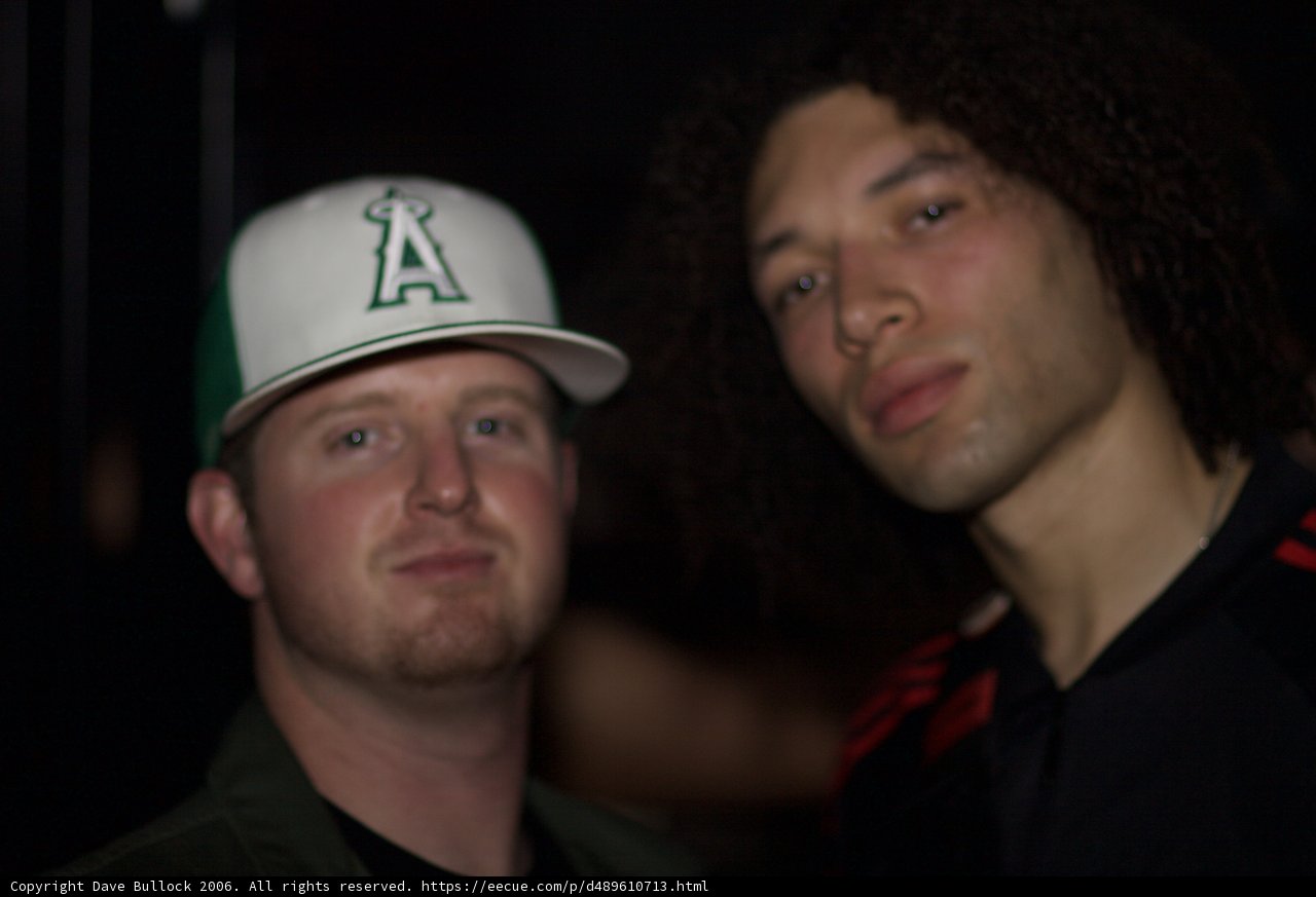 Two Men Sporting their Baseball Caps