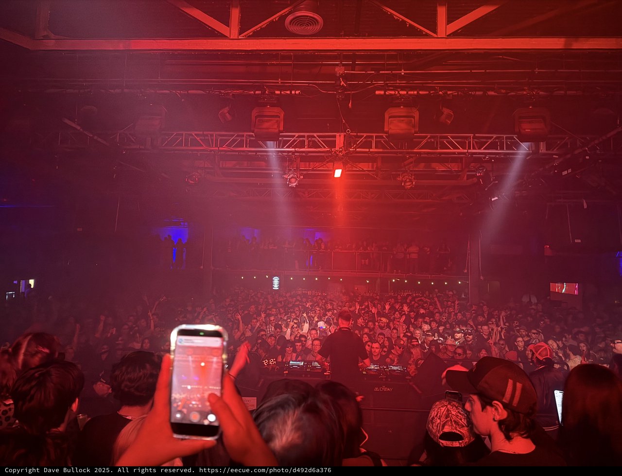 Electric Red Concert Atmosphere with Massive Crowd