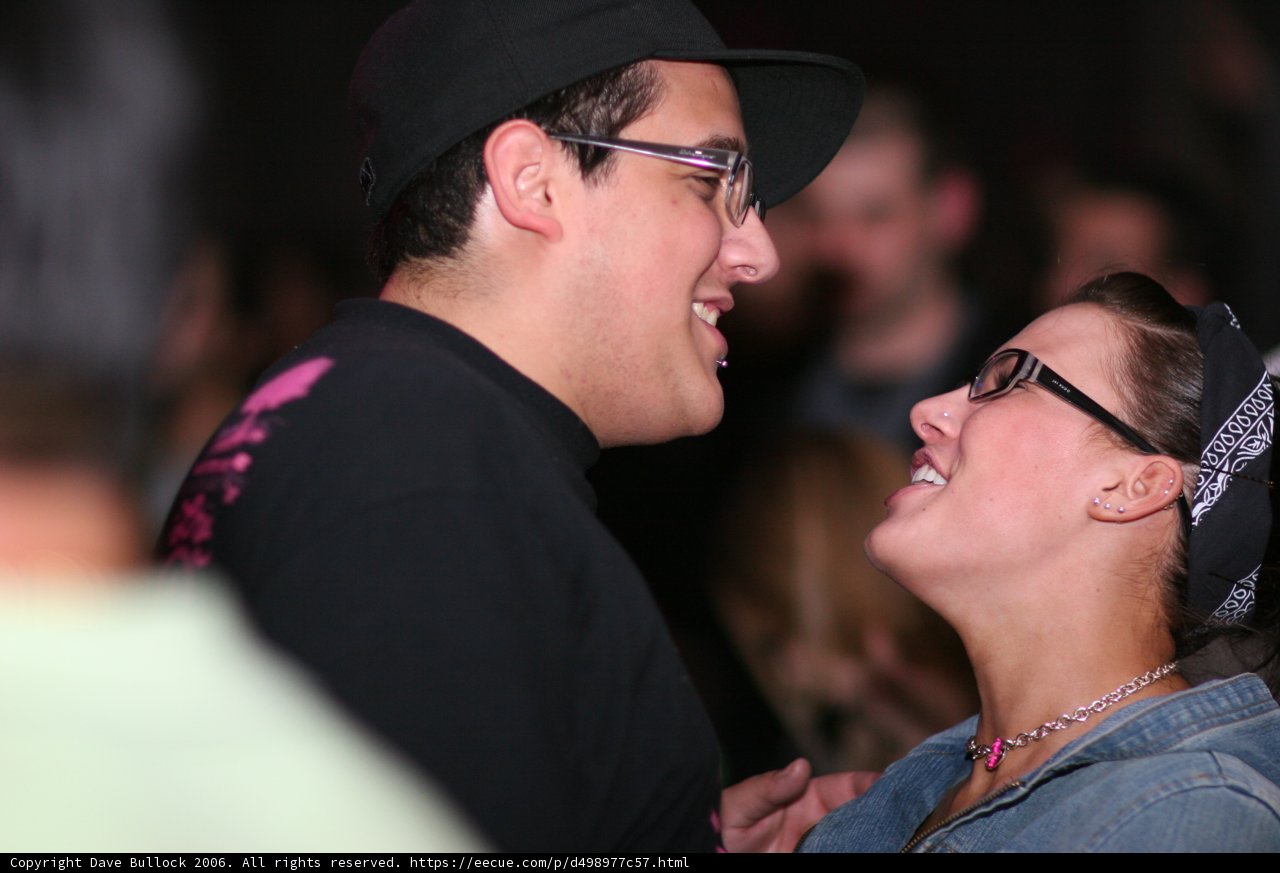 Smiling Couple with Baseball Hats