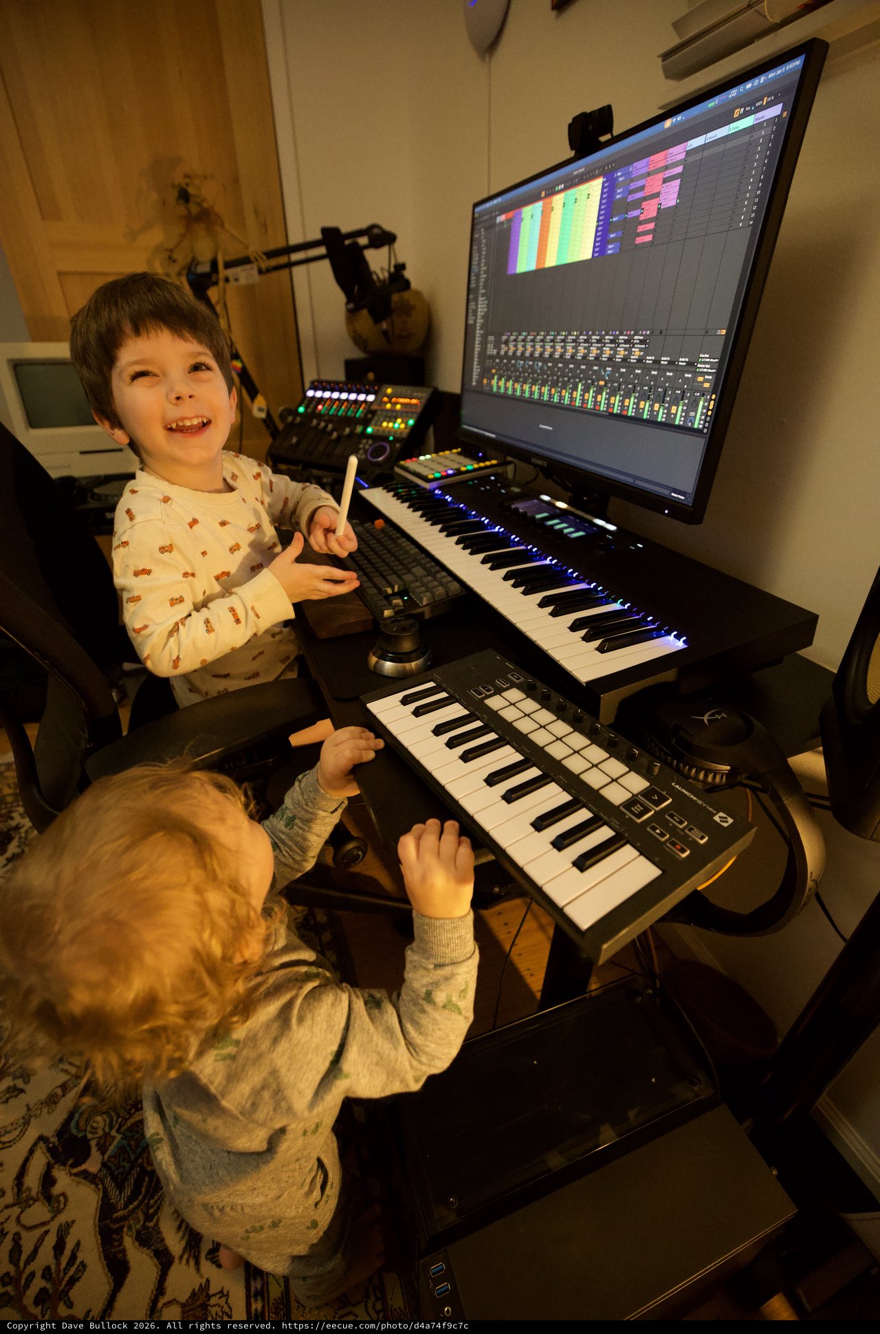 Young Brothers Making Music in Home Recording Studio