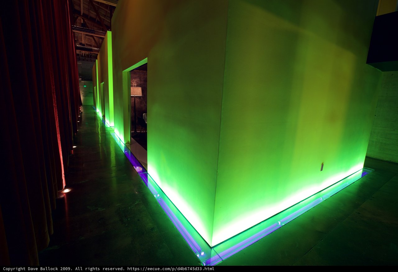 Glowing Green Wall in Corridor