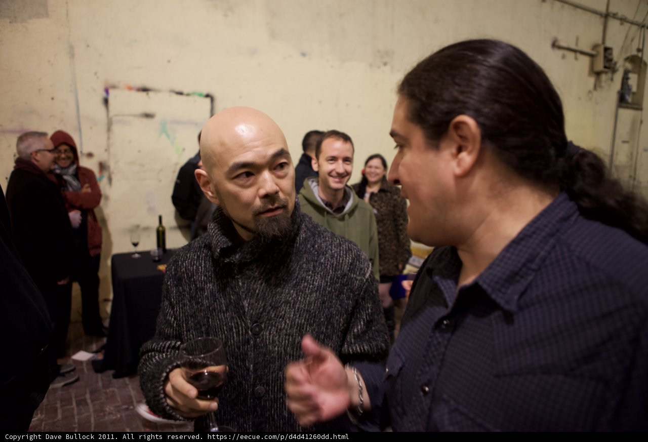 Two Men Conversing at Plata Wine Party