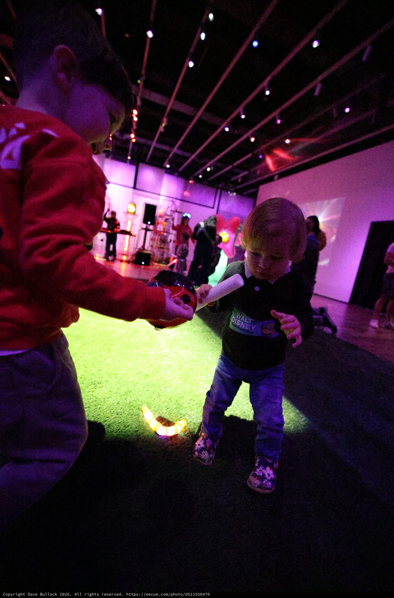 Child Dancing with Adult at Baby Rave Event