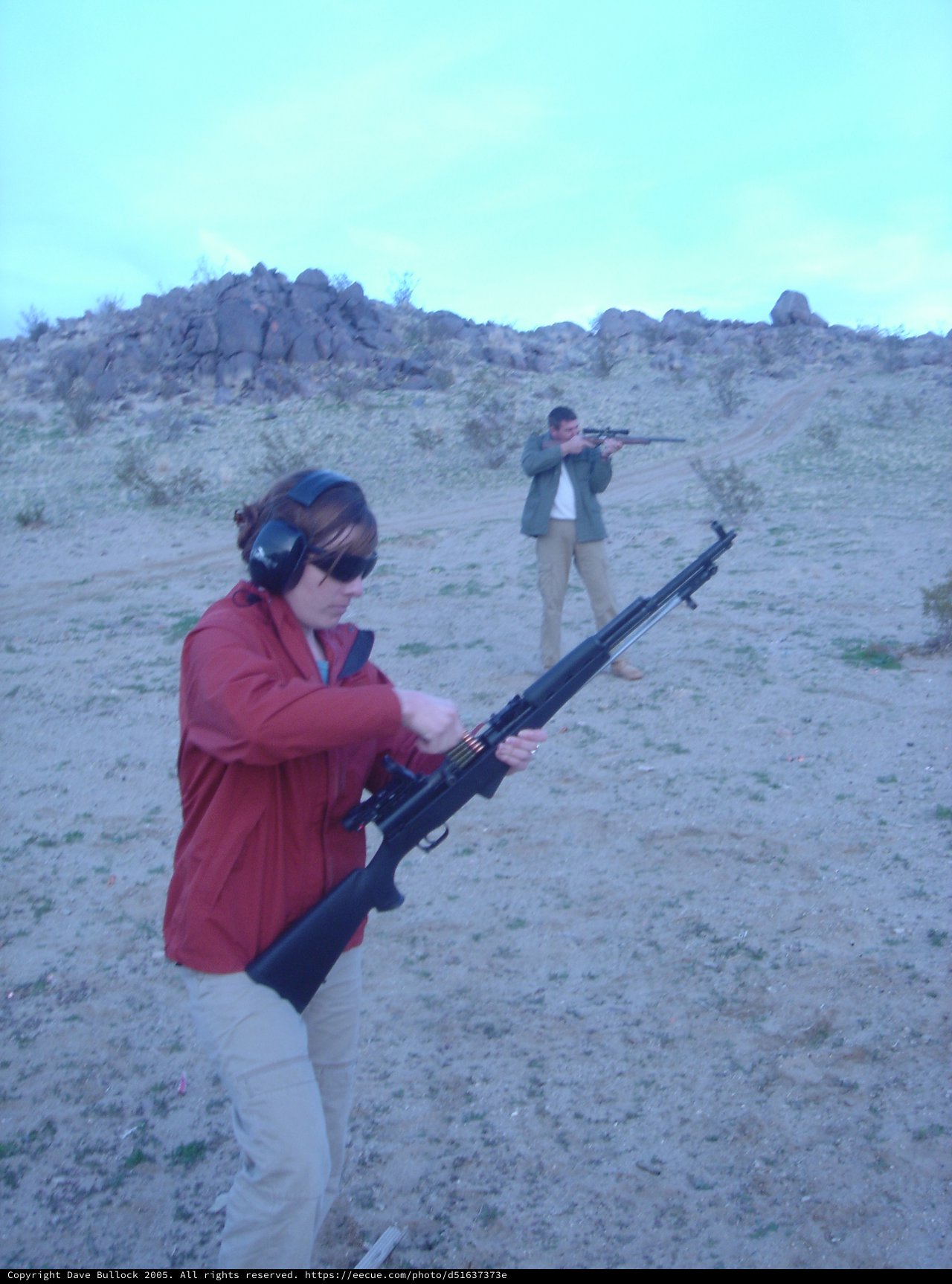 Two Shooters at Desert Outdoor Range at Dusk