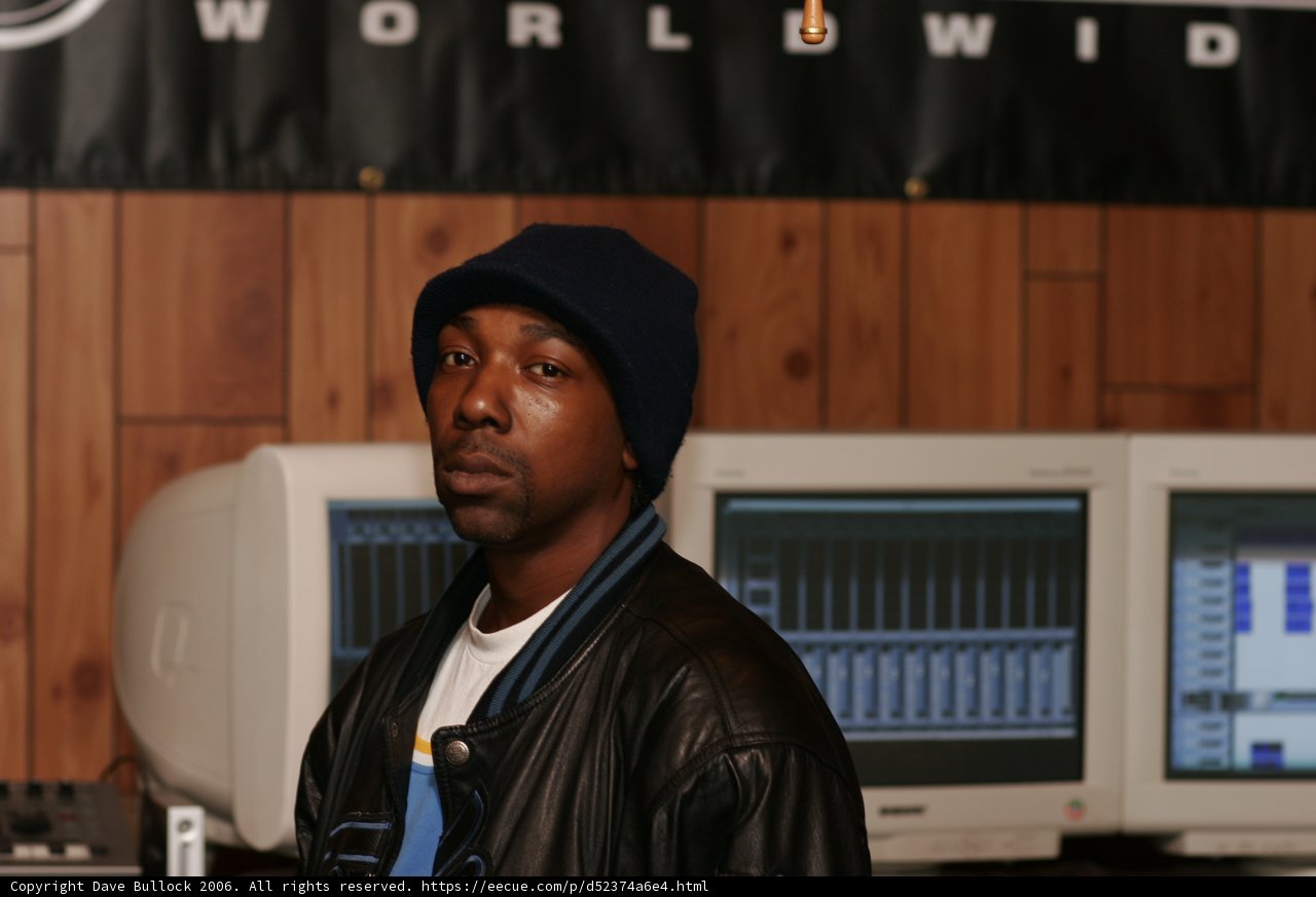 MC Eiht in a Classic Black Jacket