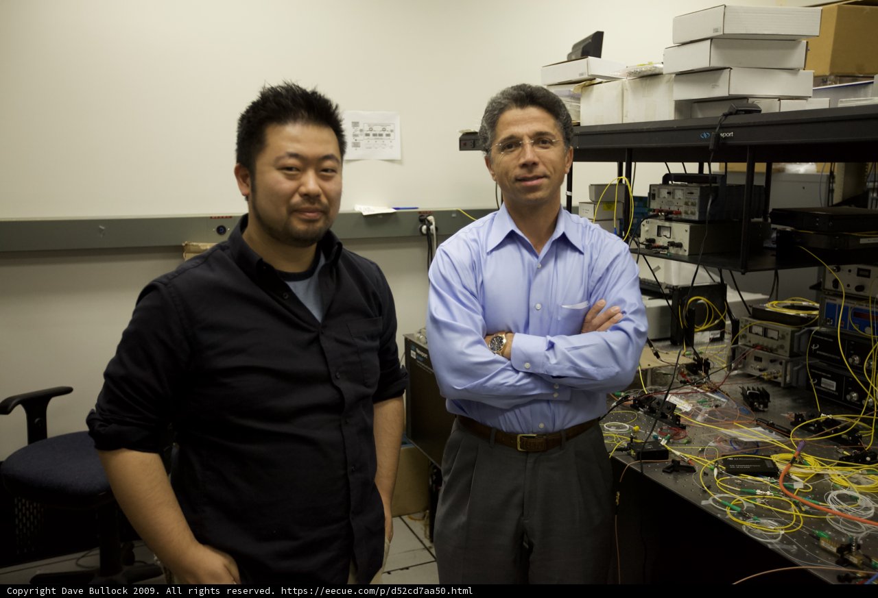 Two Men Analyzing Data on Computer
