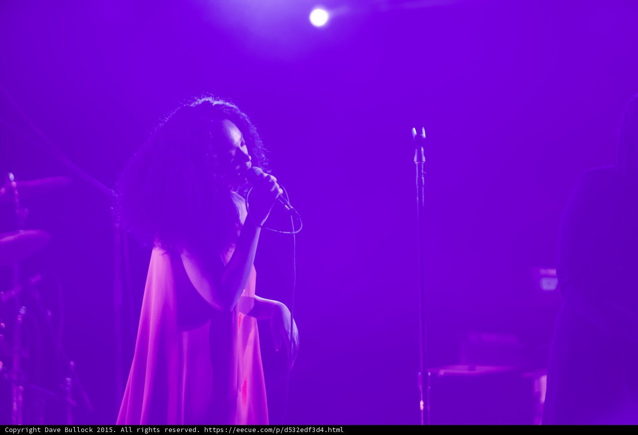 Solange Silhouette Portrait Red Dress Singing Spotlight Purple Haze