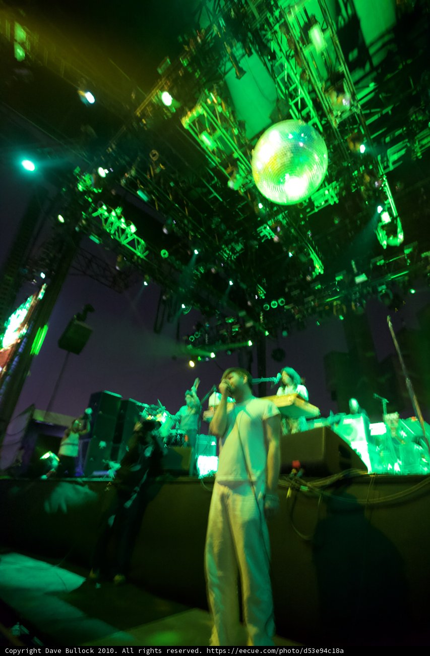 Green Spotlight Shines on a Captivated Crowd