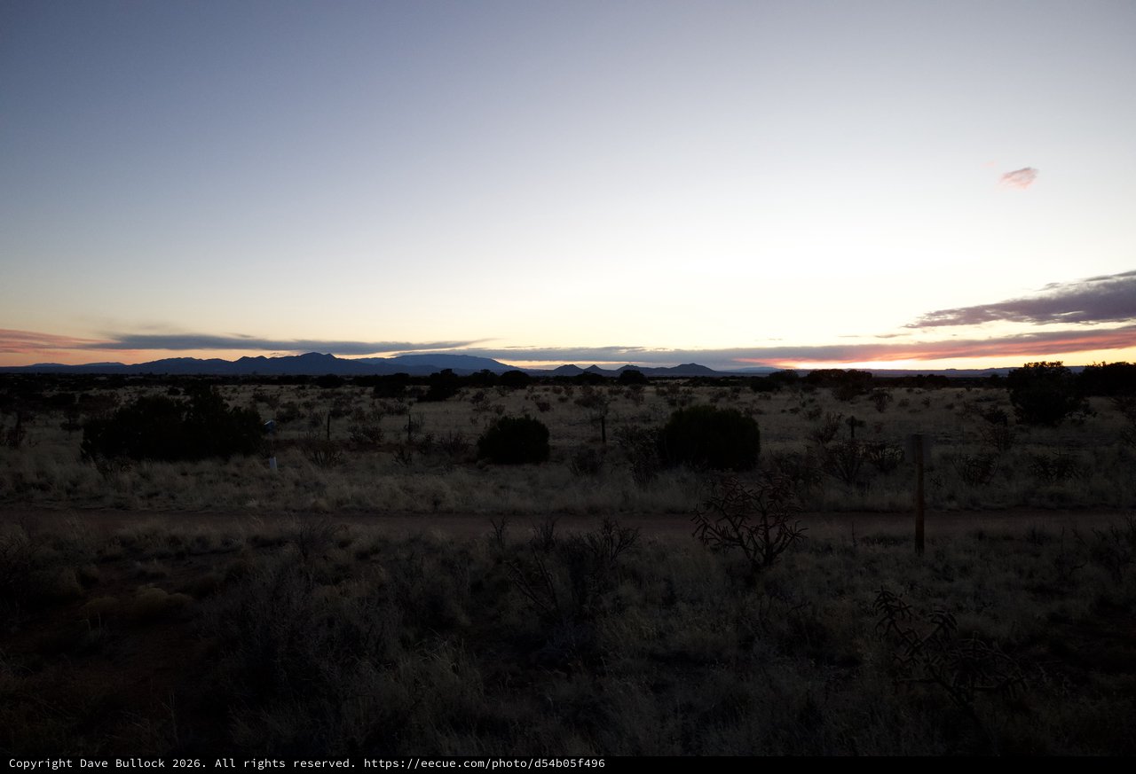 Desert Twilight Over Distant Mountain Ranges