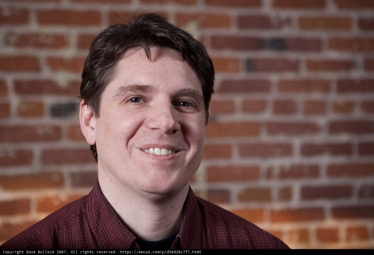 A Happy Smile against a Brick Wall
