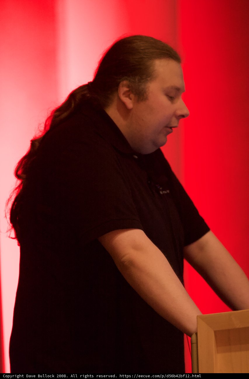 Black Shirted Man with Laptop and Box