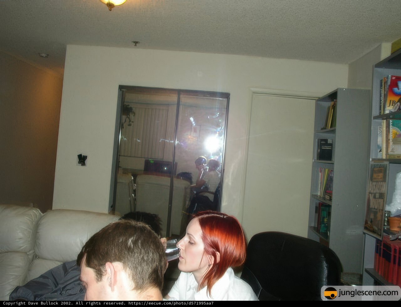 Red-Haired Woman in Cozy Living Room