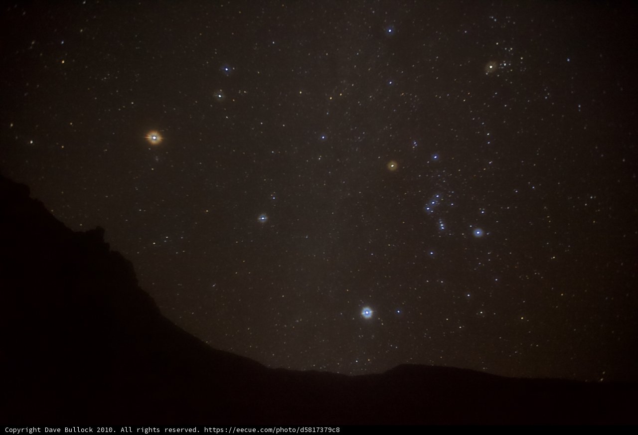 Orion Constellation shining brightly from the mountain peak