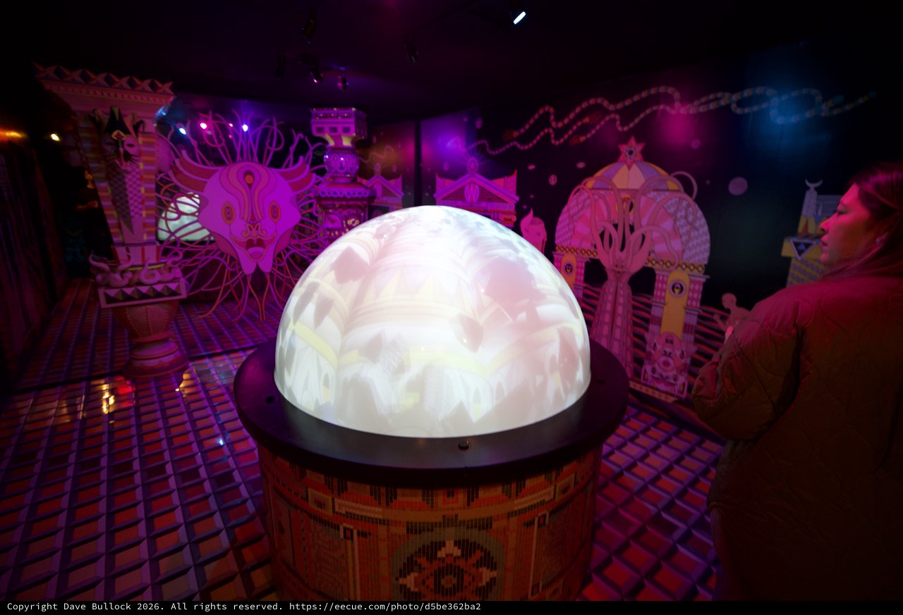 Illuminated Crystal Ball Display in Vibrant Art Installation
