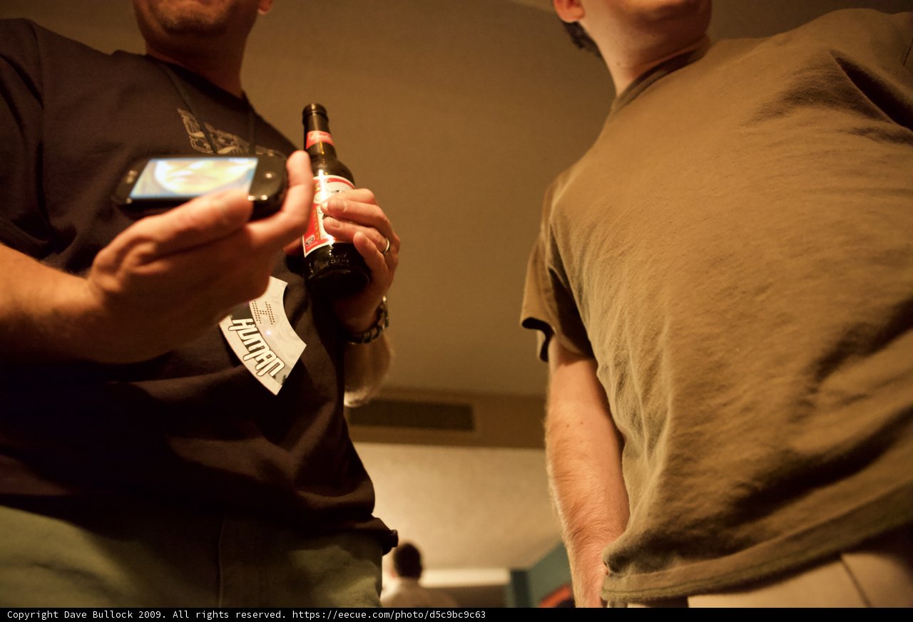 Two Men Texting and Drinking Beer