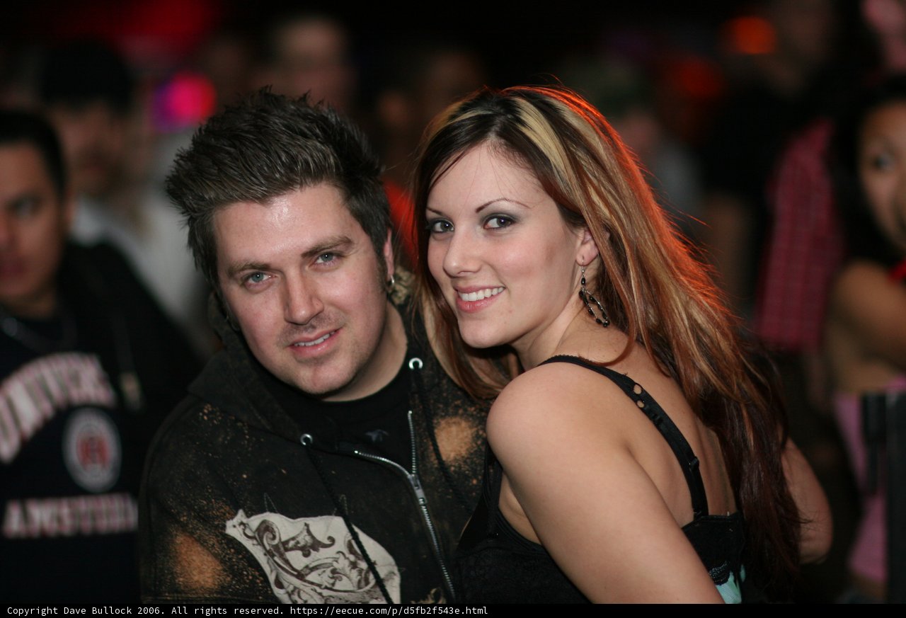 Nightclub Couple Pose for Photo