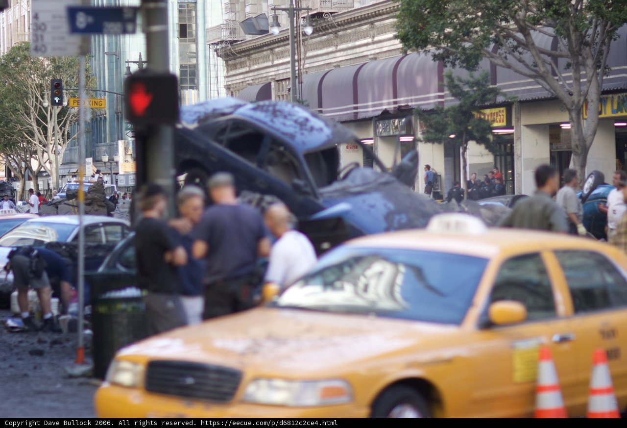Car engulfed in flames on busy street