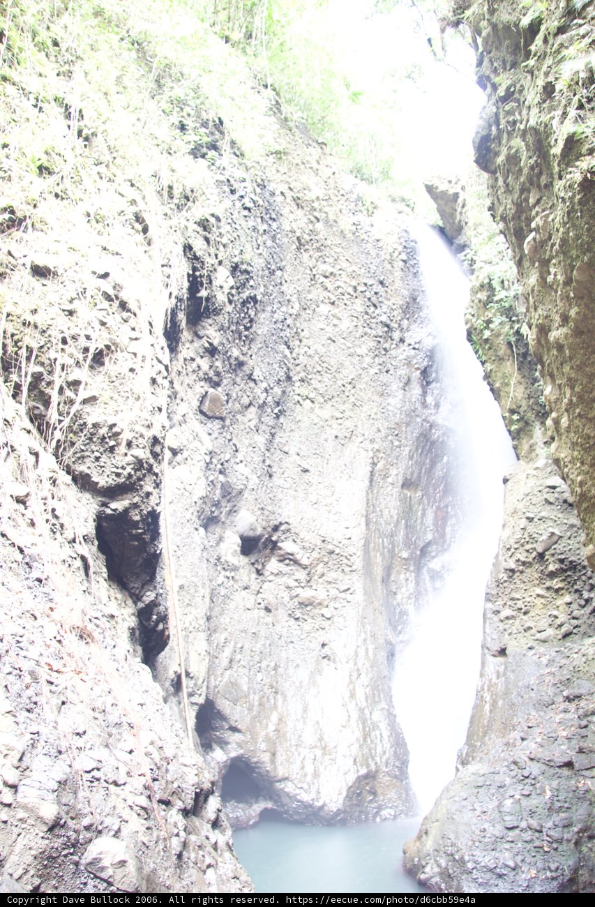 Majestic Waterfall Amidst Nature's Glory