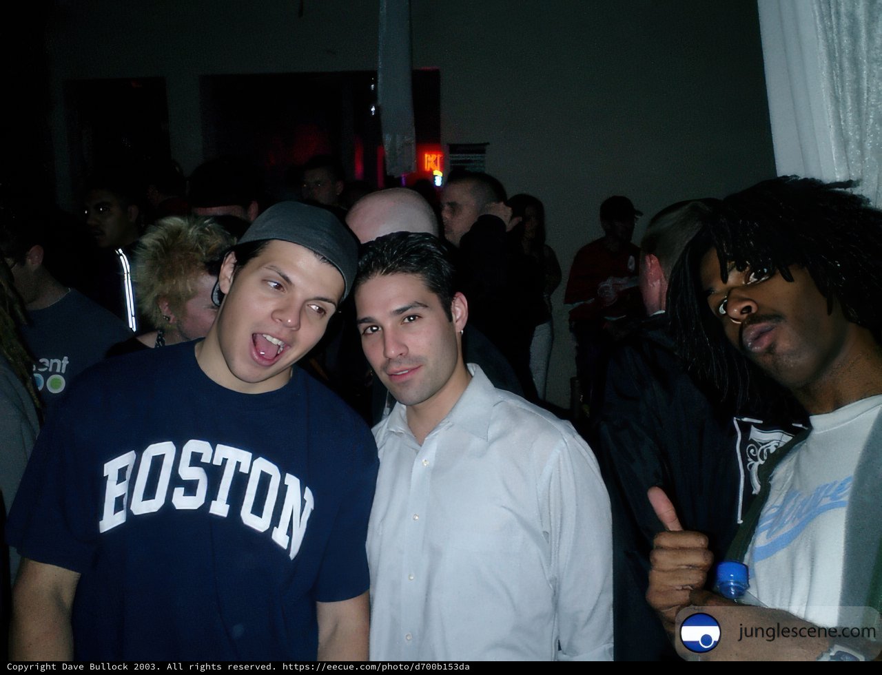 Two Men Sporting Hats at Nightclub Party