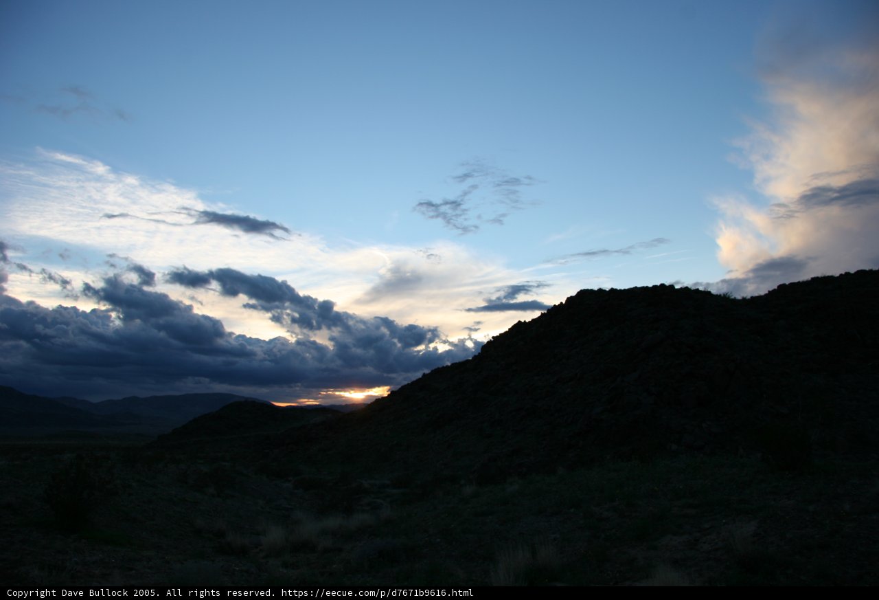 Serene Sunset over Rocky Hillside