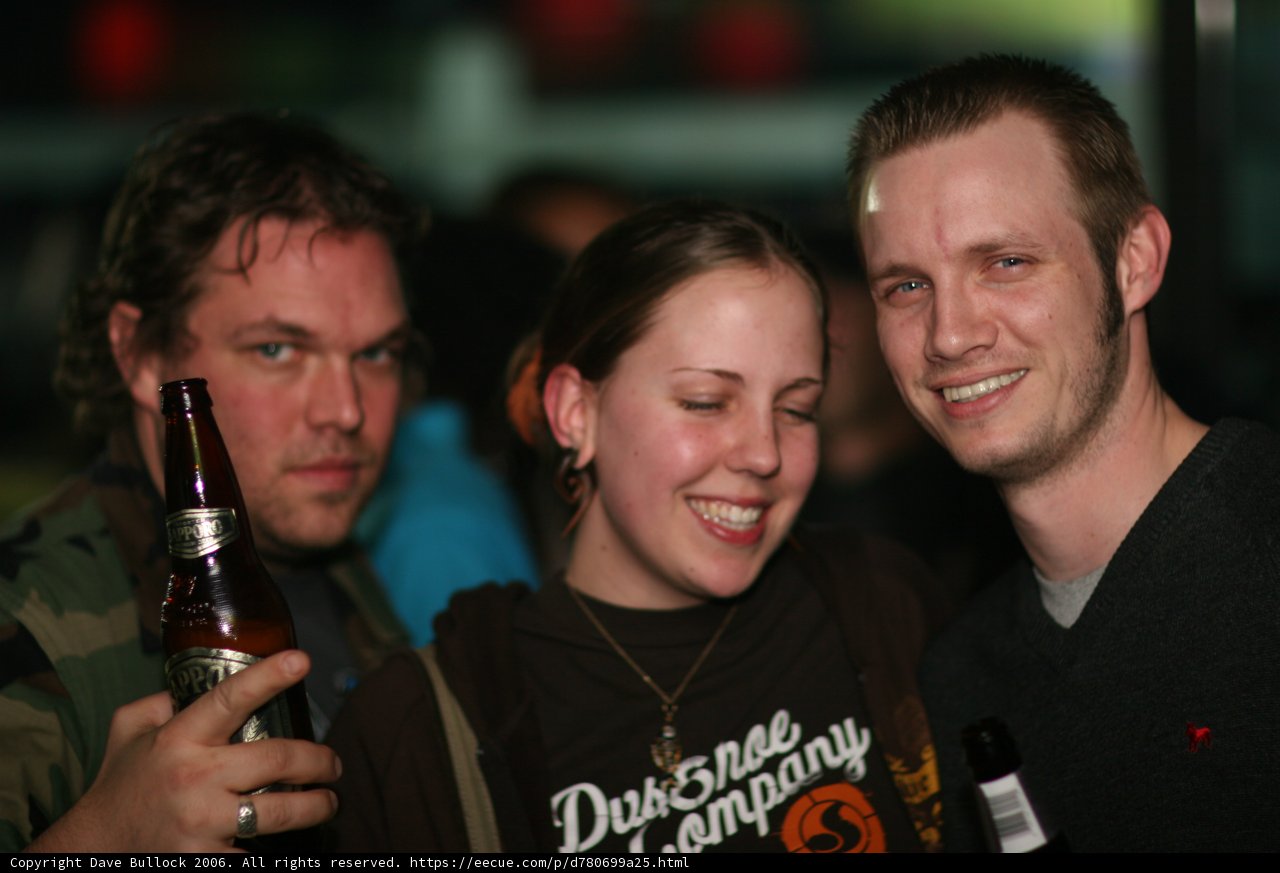 Black Shirted Man Enjoying a Bottle of Beer