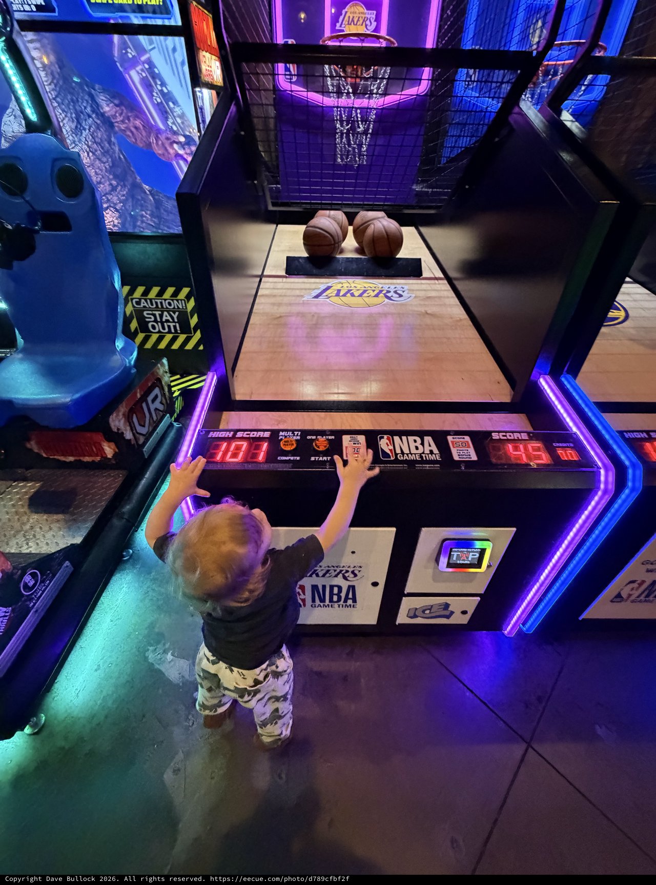Young Child Playing NBA Arcade Basketball Game