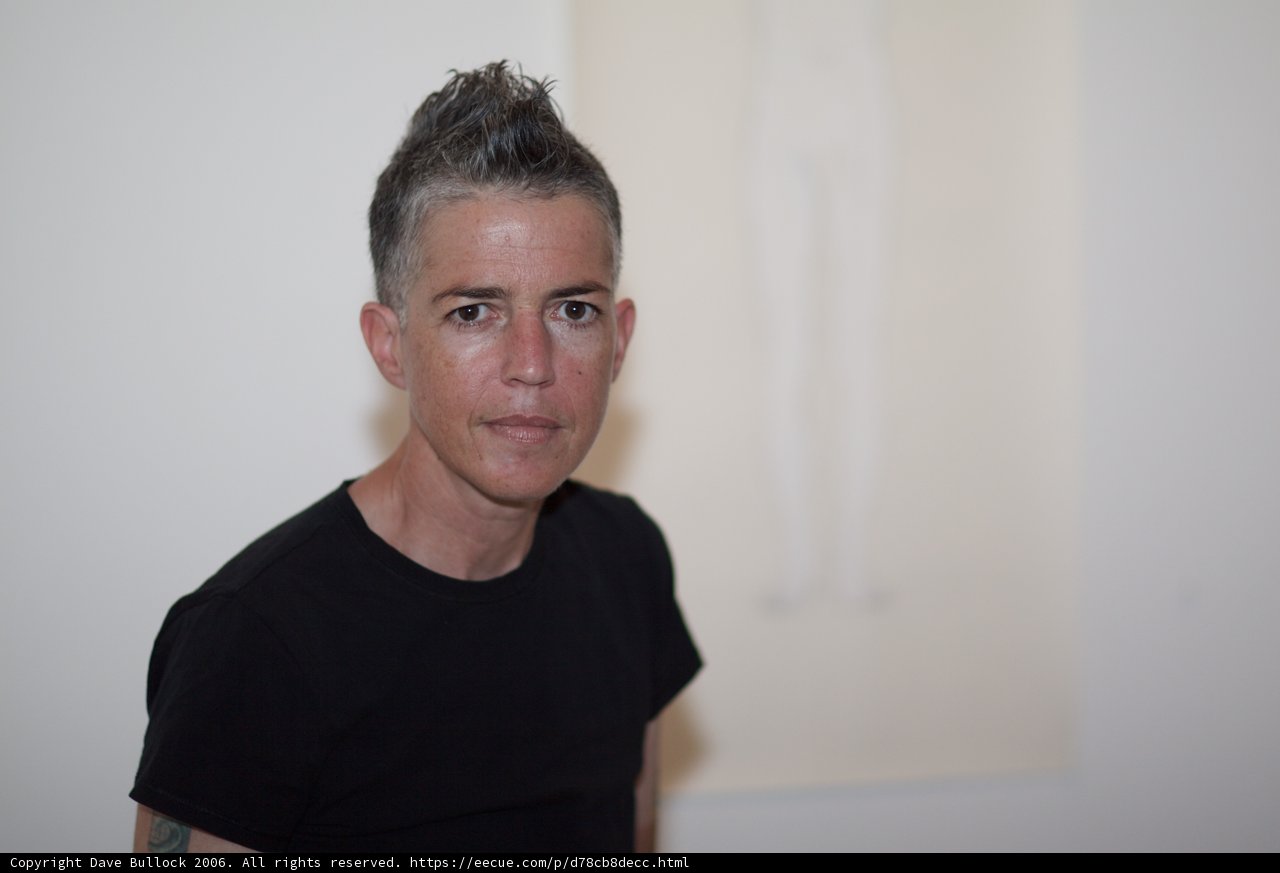 Portrait of a Happy Woman in a Black T-Shirt