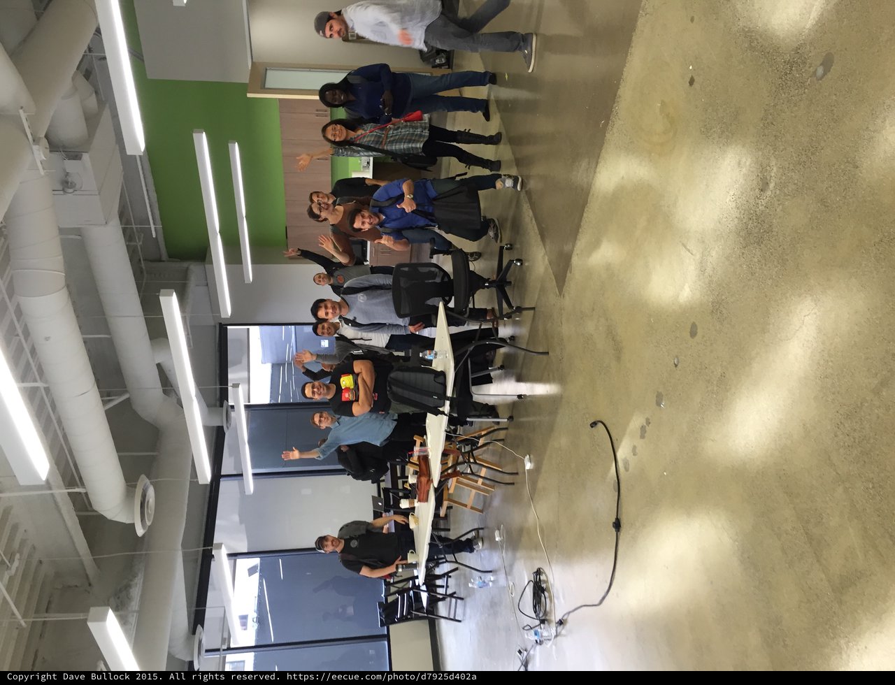 Tech Meetup Group Celebration in Modern Office Space