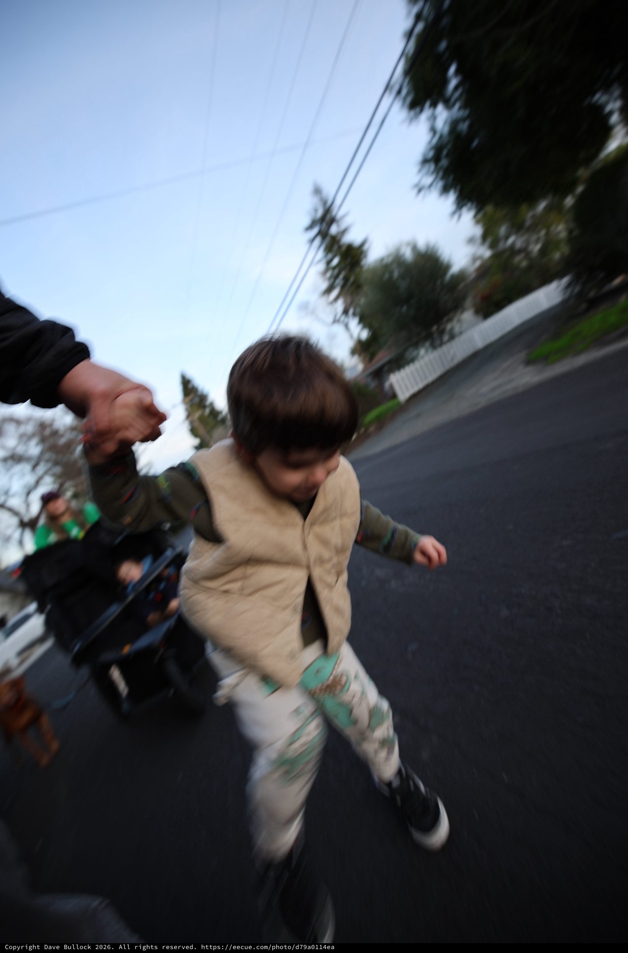 Child Running on Suburban Street at Dusk