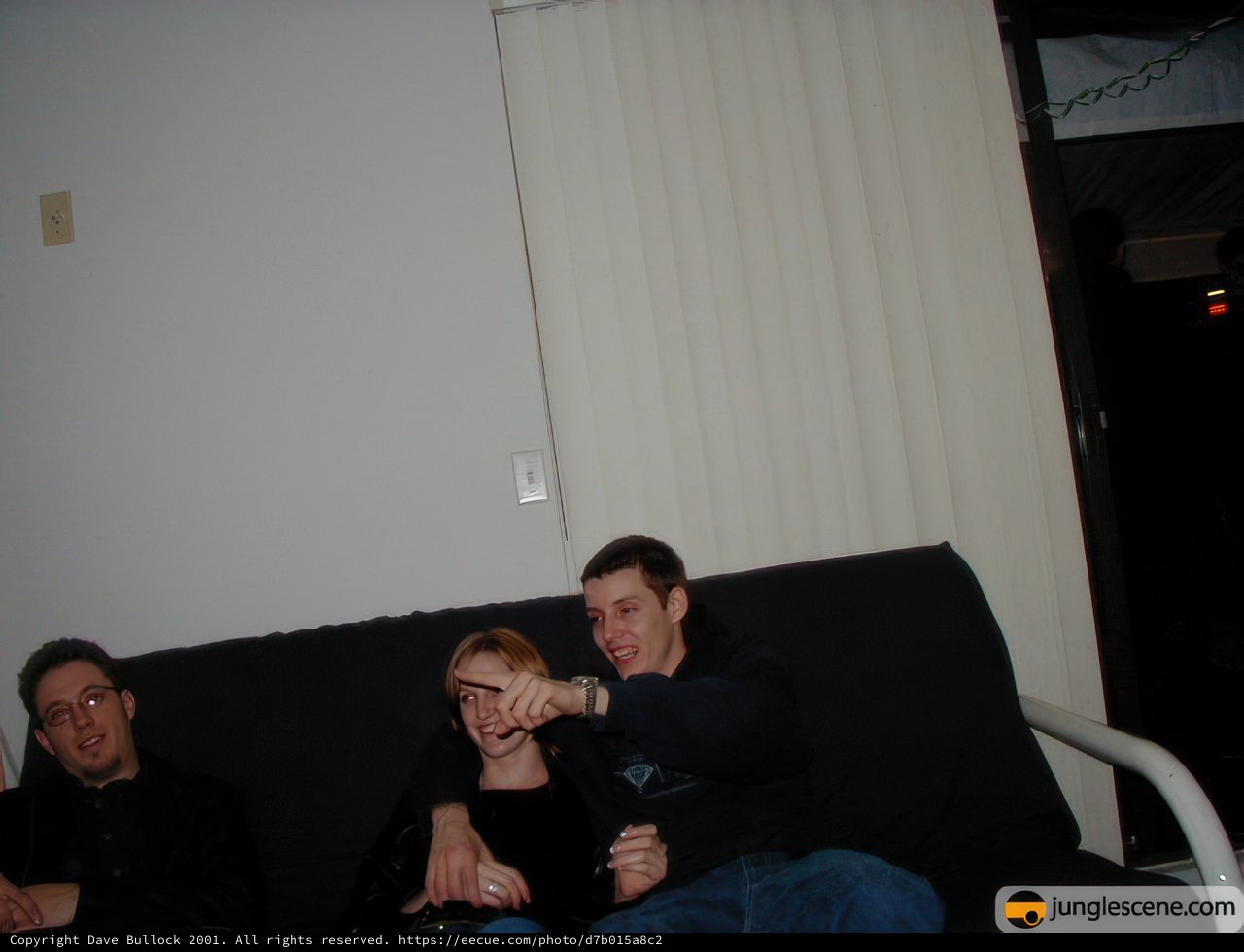 Two Men Relaxing on a Cozy Couch