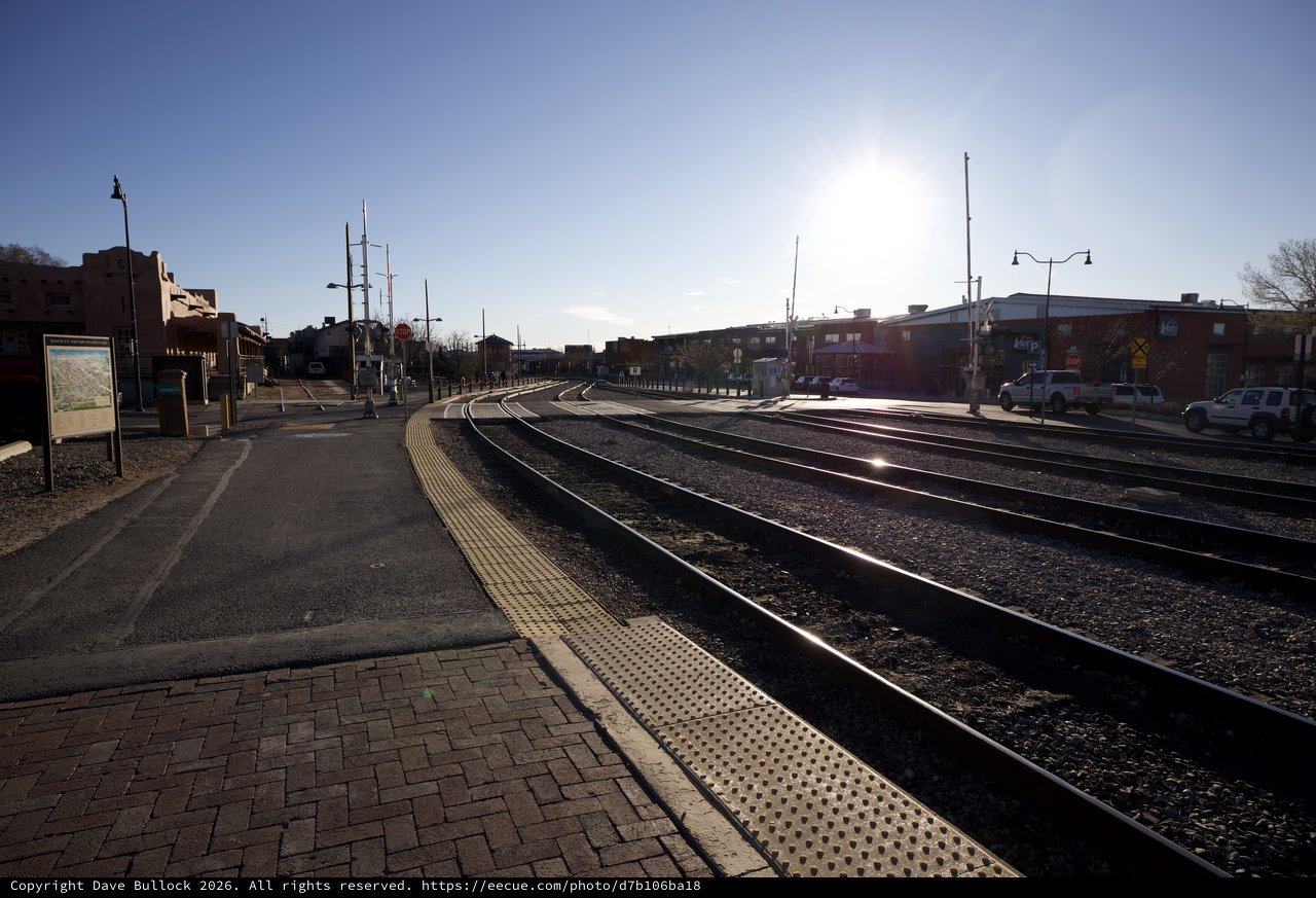 Sunlit Railroad Tracks Curve Through Santa Fe Station