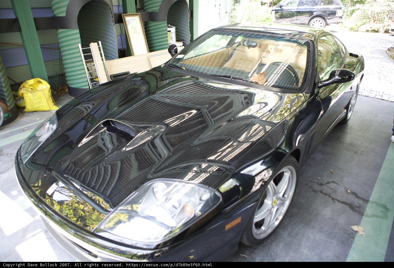 Black Sports Car in a Sleek Garage