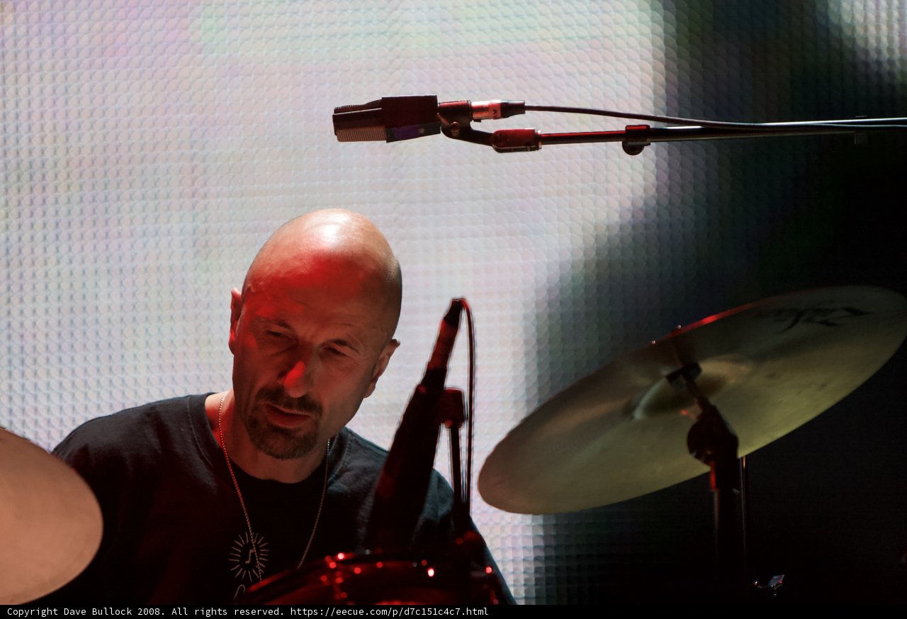 Bald Man Expressing His Musical Talent On Stage