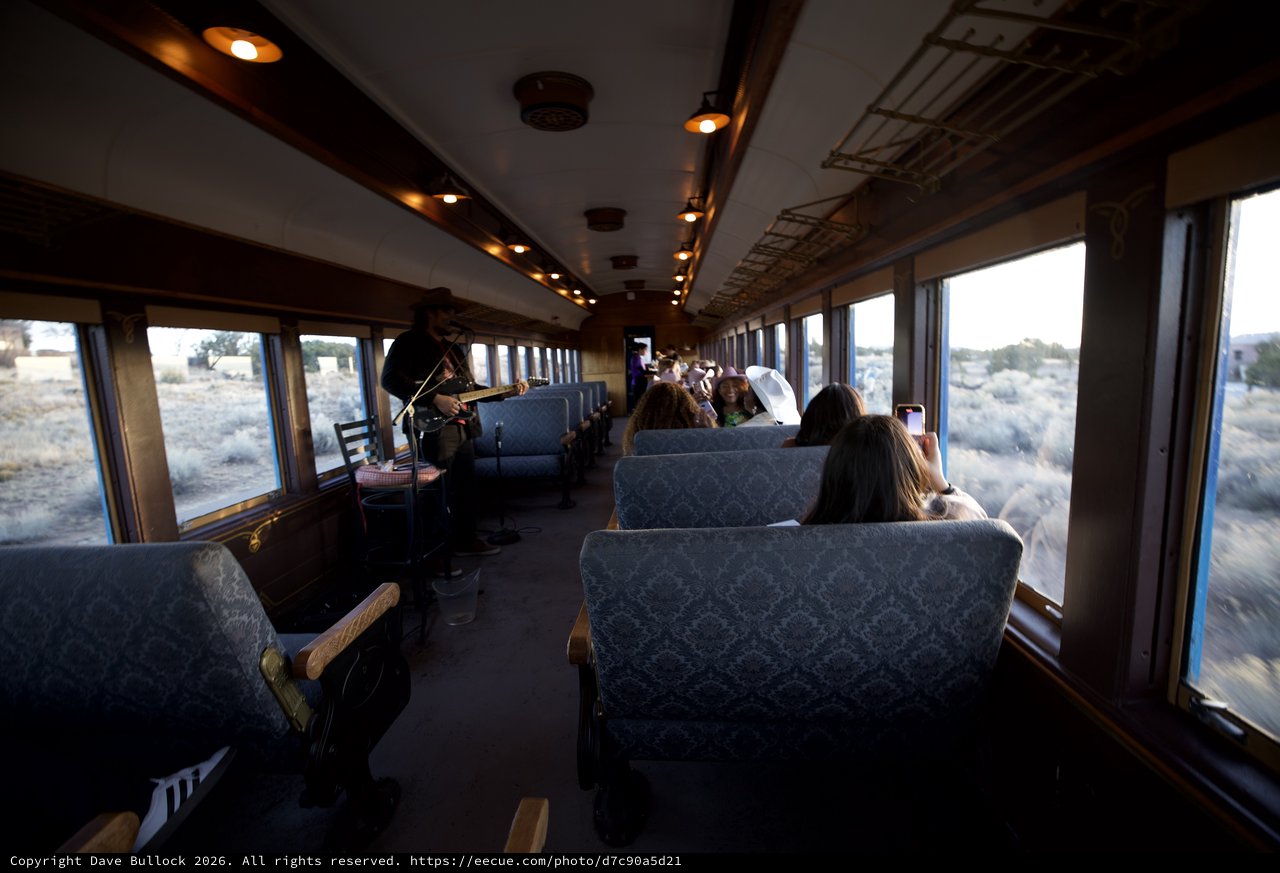 Vintage Train Journey Through Desert Landscape with Violinist