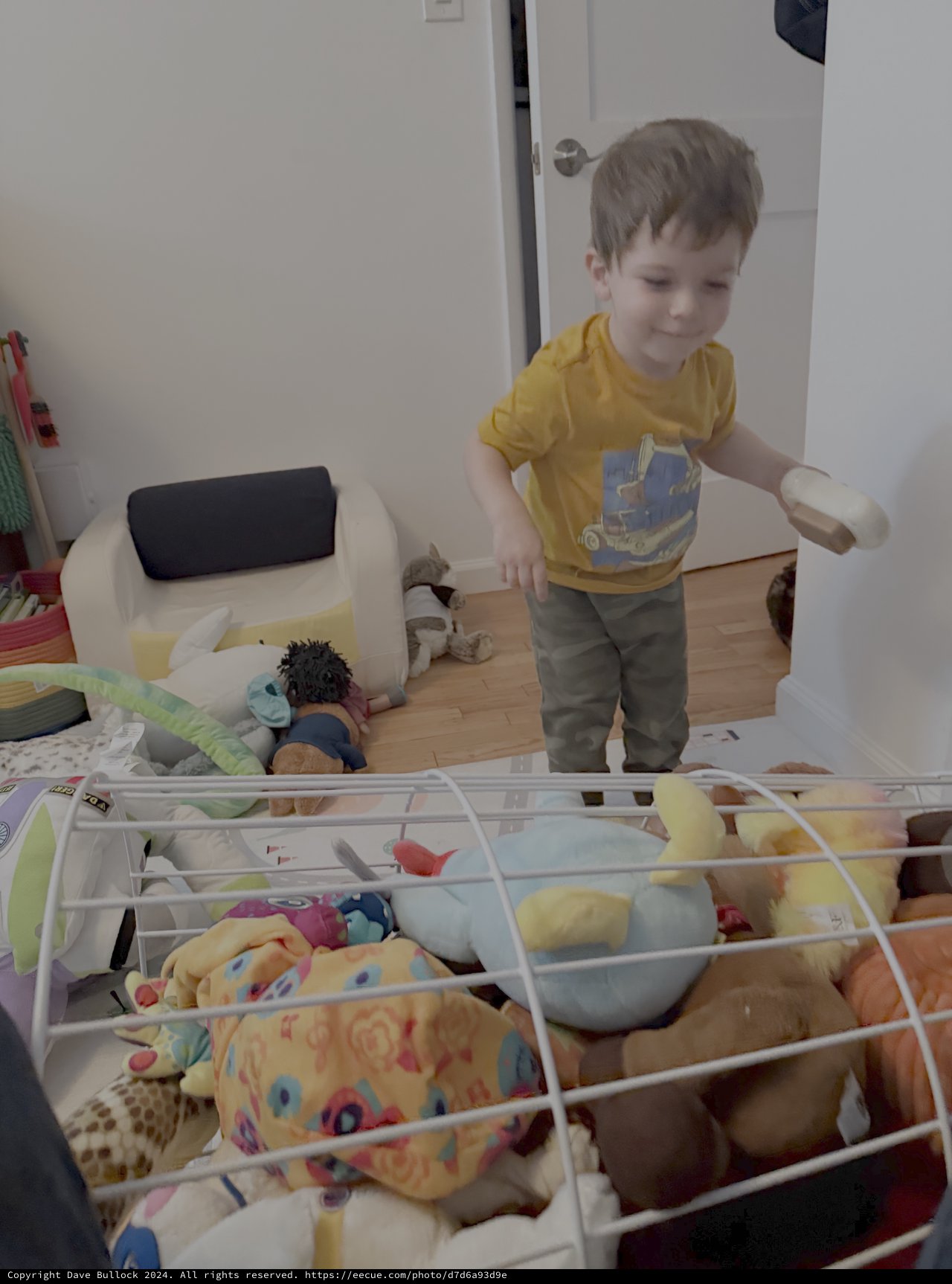 Young Boy Playing in Organized Bedroom