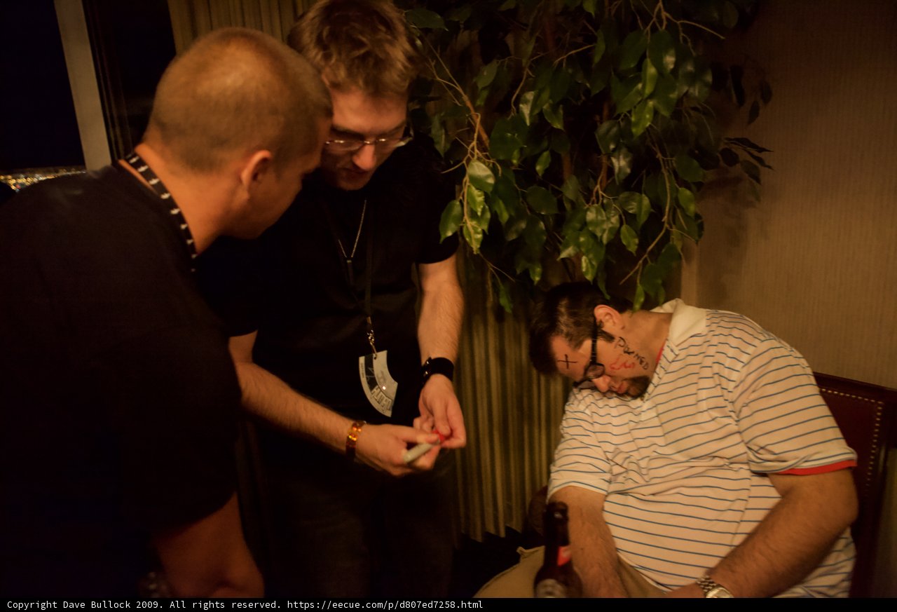 Slumbering Patient Surrounded by Three Men