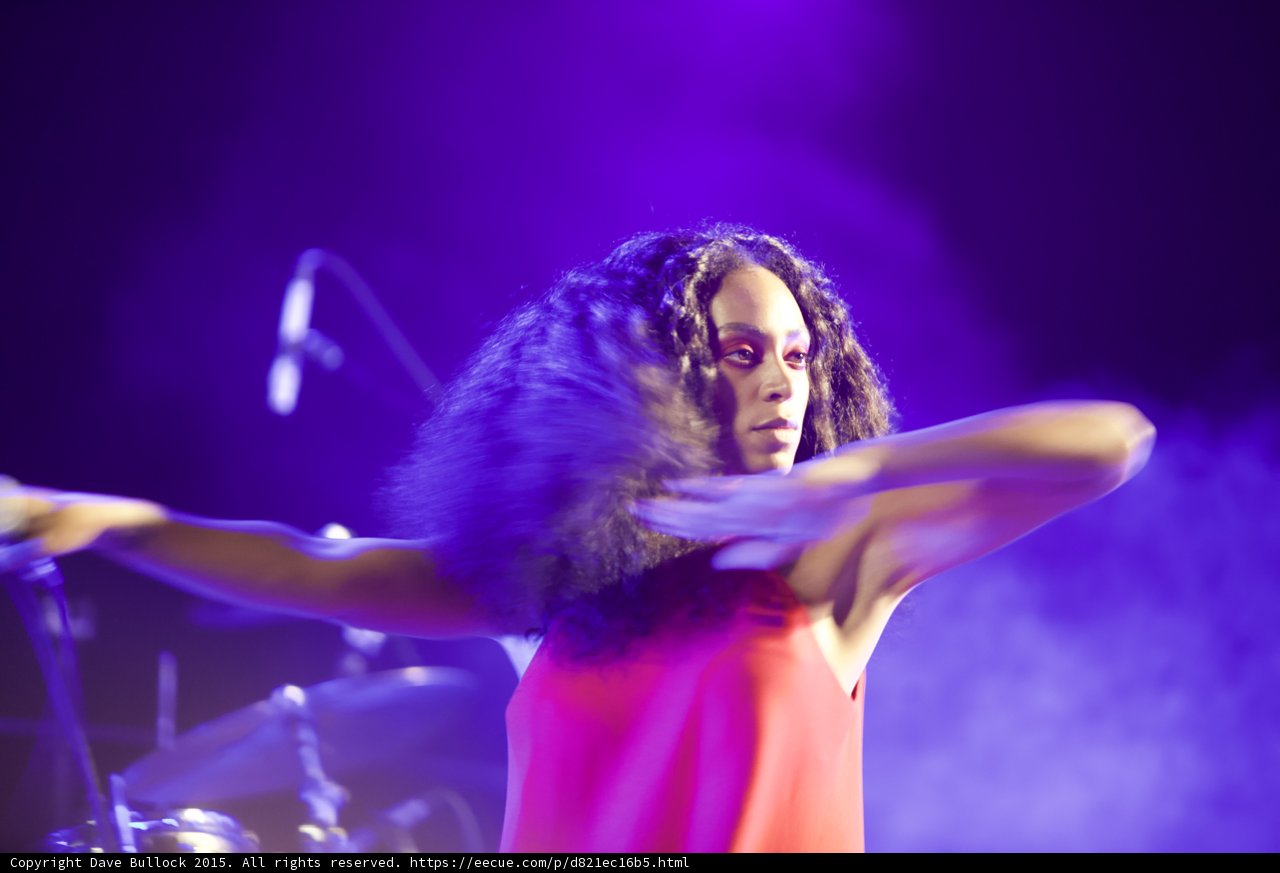 Solange Arms Spread Wide Facing Camera Direct Gaze Purple