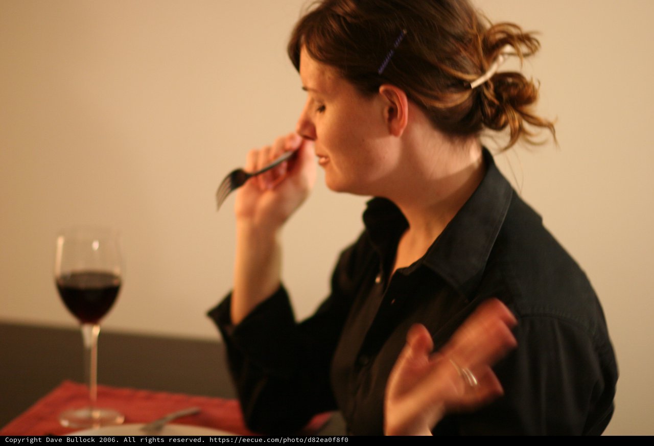 Woman Dining with Red Wine at Intimate Dinner